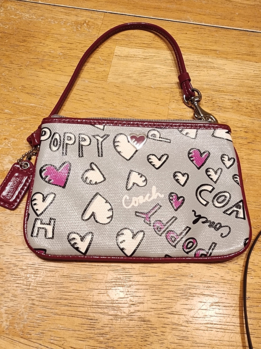 Coach Poppy Heart Theme Pink Patent Trim Logo Wristlet Purse Bag.